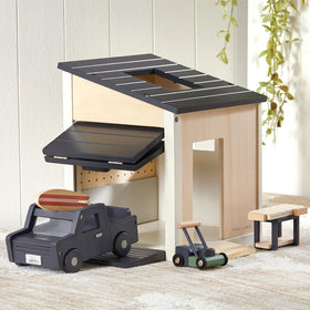 Tiny Land dollhouse garage set for immersive pretend play.