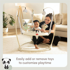 Tiny Love peek-a-boo wheel supports cognitive play while entertaining caregiver interaction.