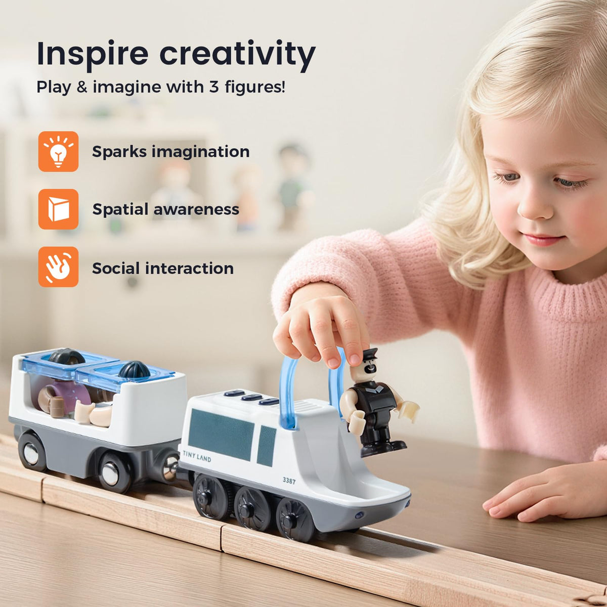 Tiny Land battery-operated locomotive side view shows magnetic connectors for easy setup.