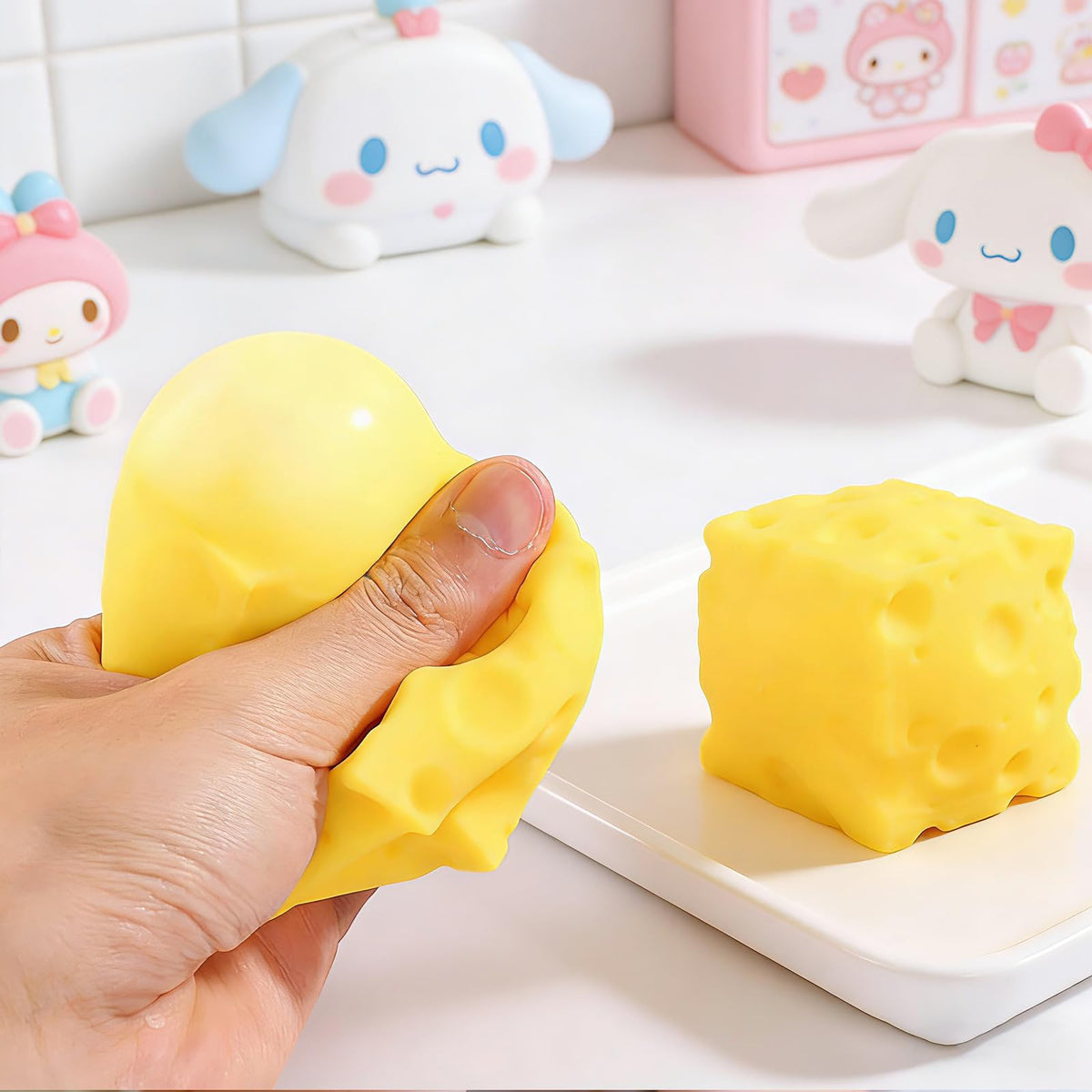 TLM Cheese Squishy on desk emphasizing design and rebound