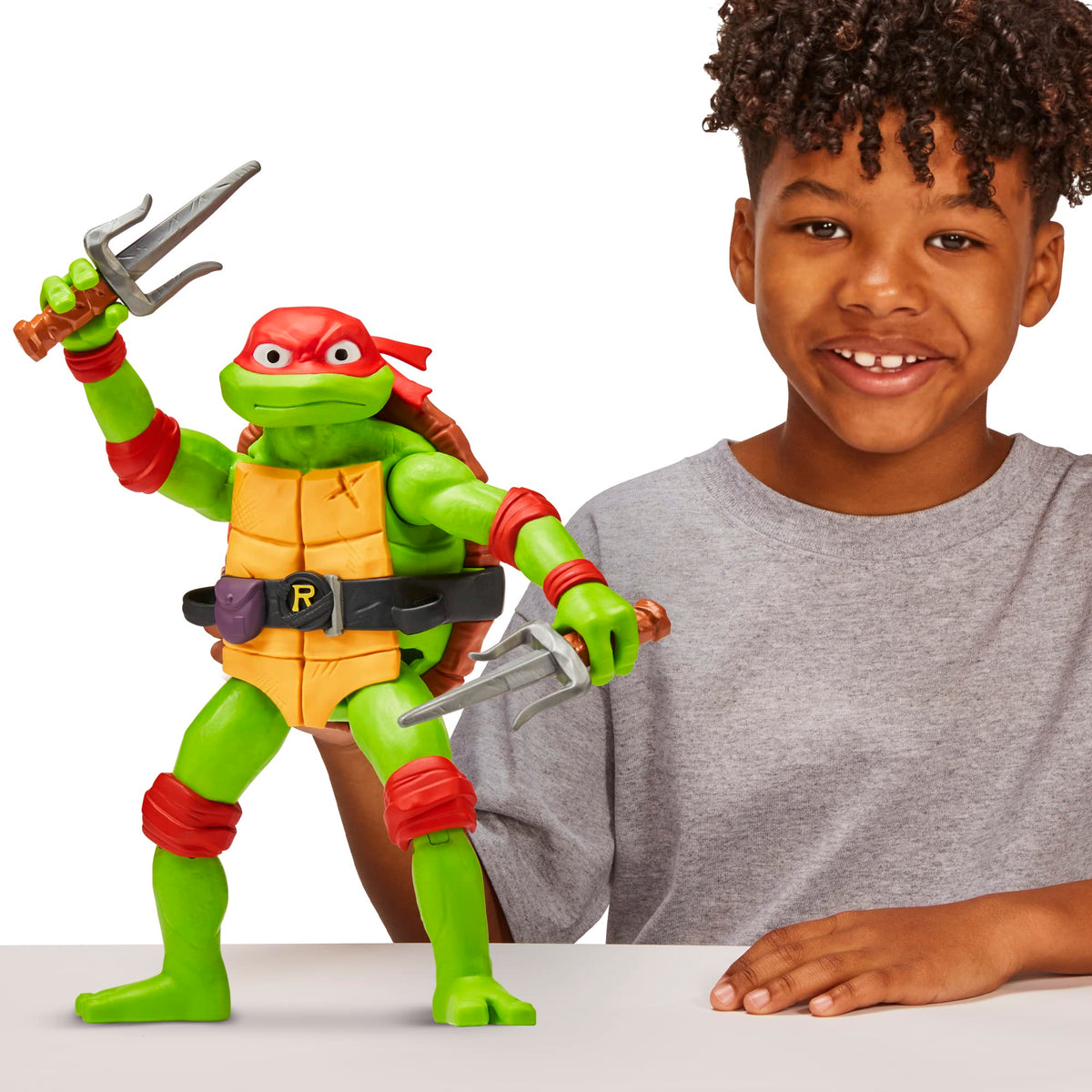 TMNT Mutant Mayhem Raphael 12-inch figure articulation demonstrated for dynamic poses