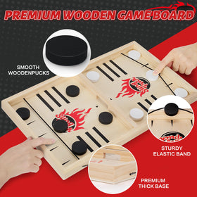 Toidgy puck game in play with pucks mid-air for fast-paced skill