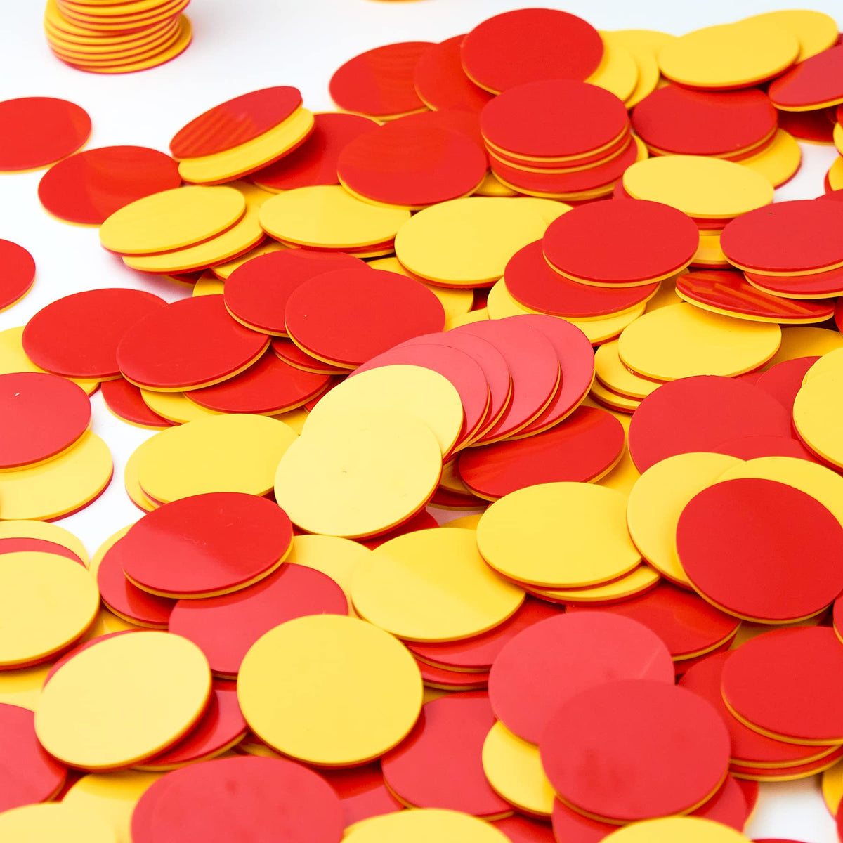 TOMMYHOME two-color counter red and yellow held by a child for hands-on math play.