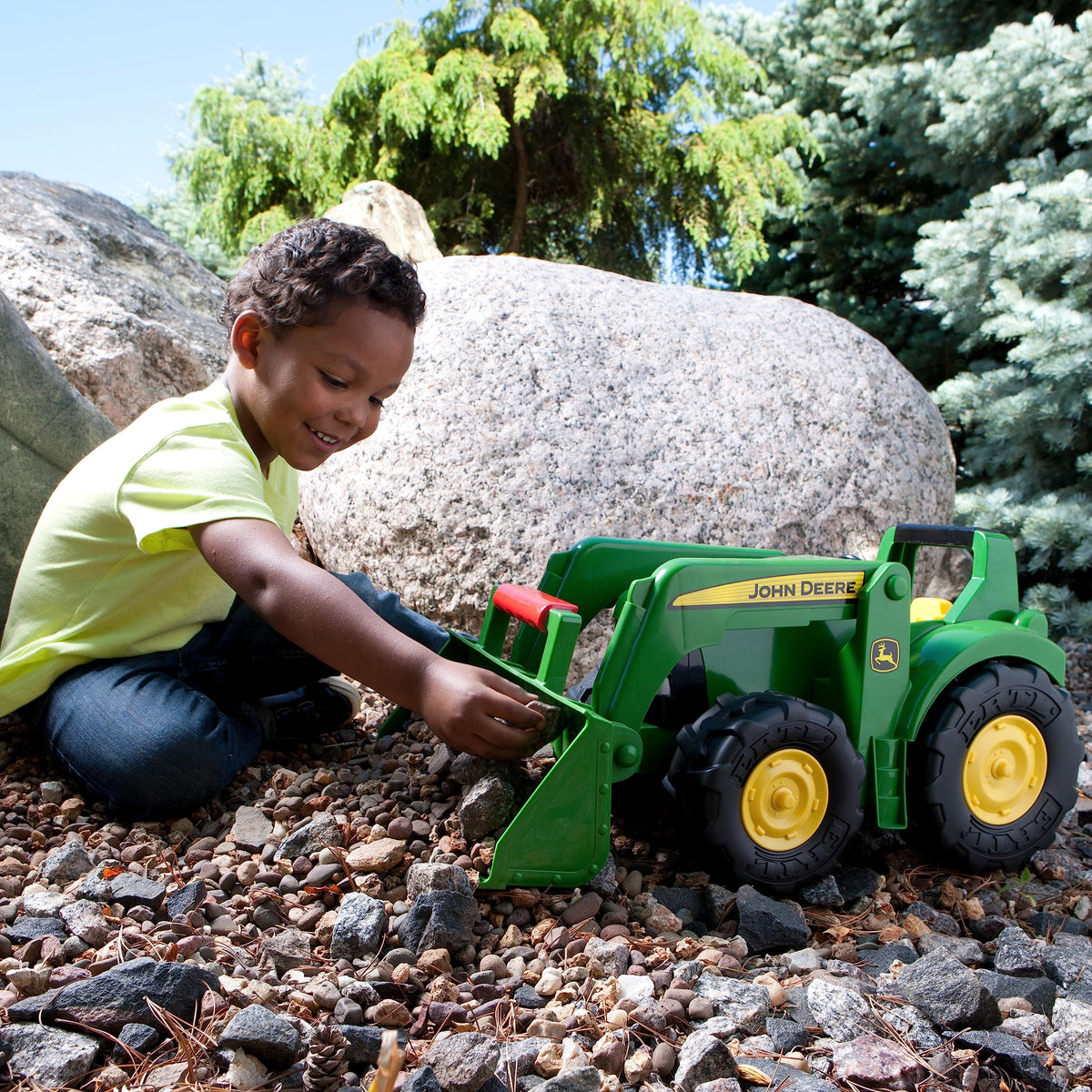 TOMY John Deere 21-inch Big Scoop Tractor outdoor action with sturdy wheels.
