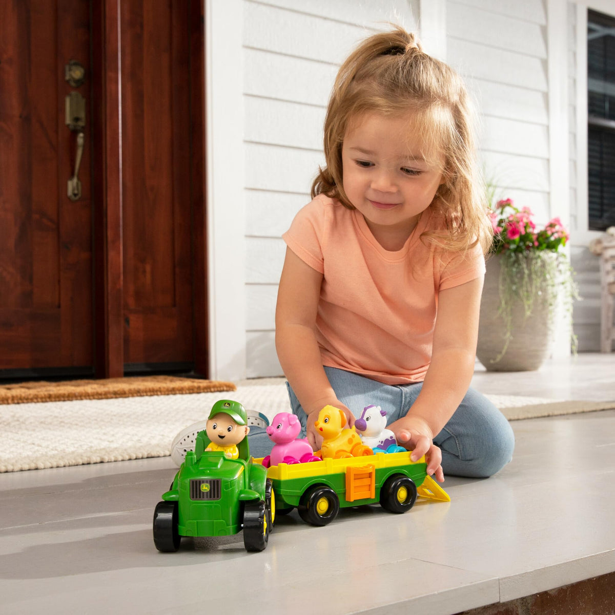TOMY John Deere push-along tractor with wagon—engages active play