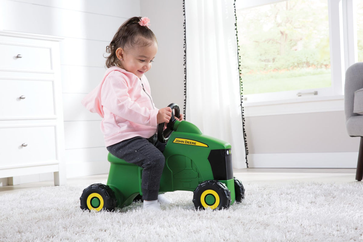 TOMY John Deere Sit N Scoot tractor side view shows kid powered motion