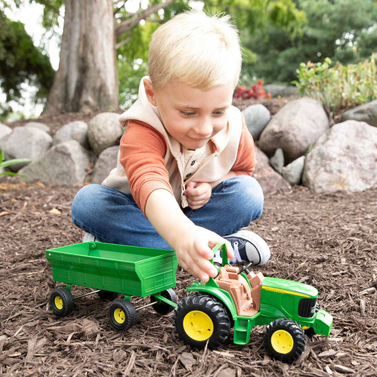 TOMY John Deere tractor features a die-cast hood for durability.