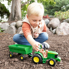 TOMY John Deere tractor features a die-cast hood for durability.