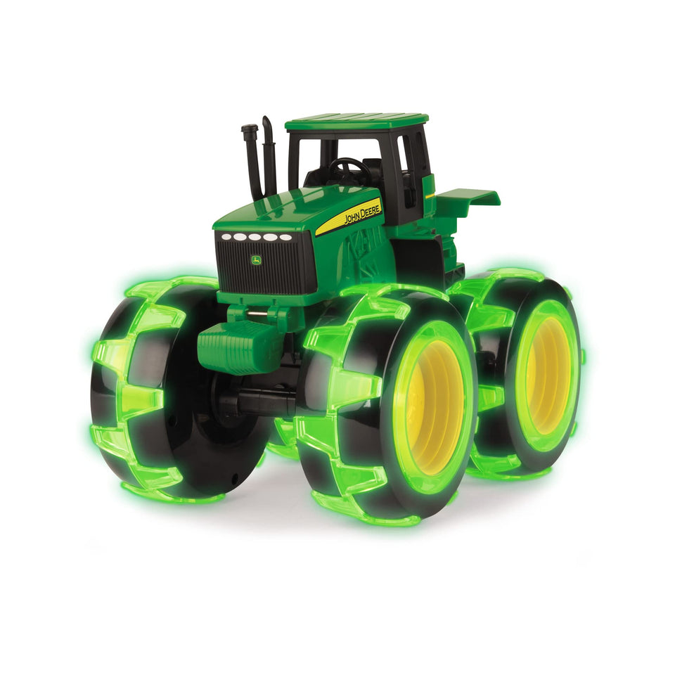 TOMY Monster Treads John Deere Tractor from the side with glowing monster tires for outdoor play