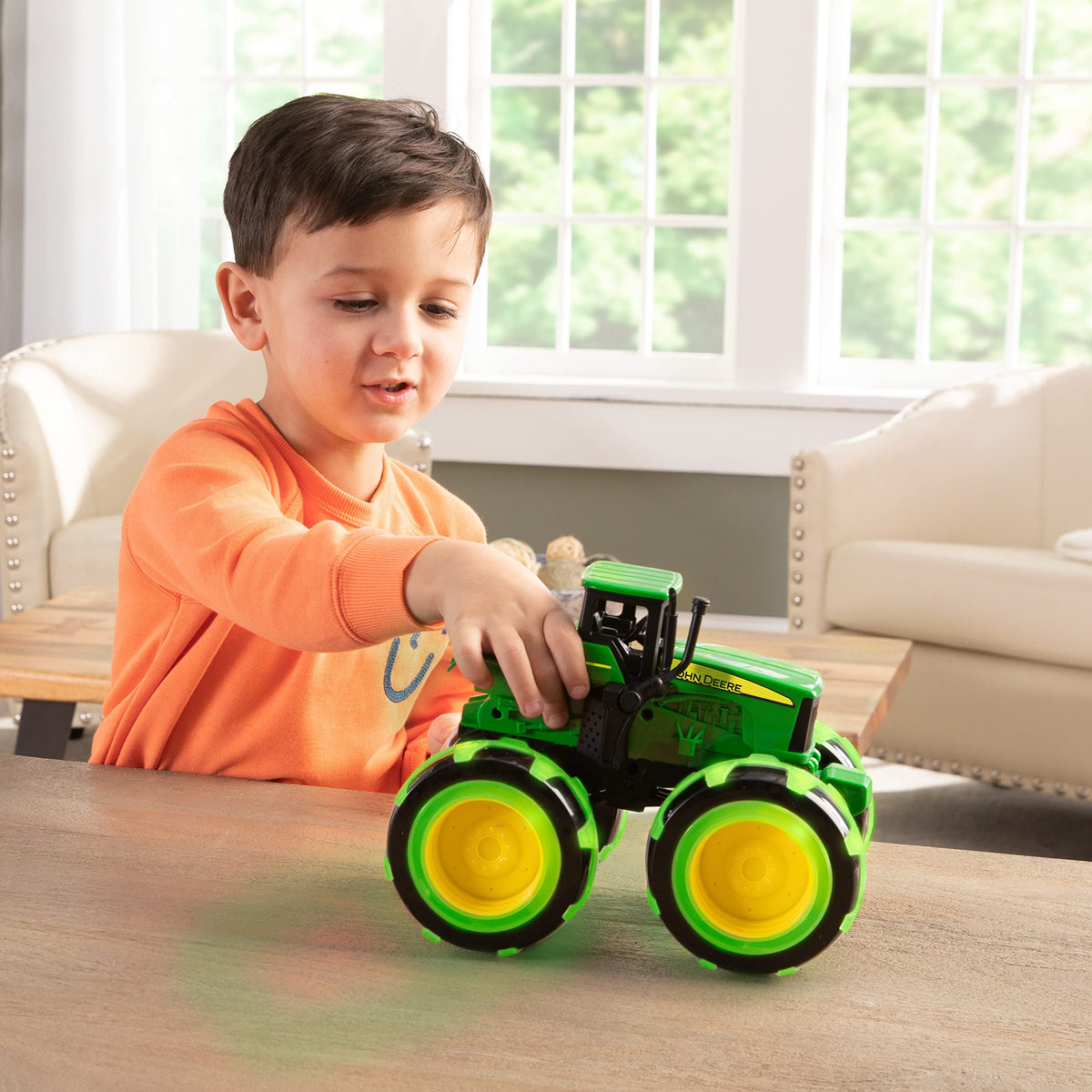 TOMY Monster Treads Lightning Wheels Tractor light-up wheels energize nighttime imaginative play.