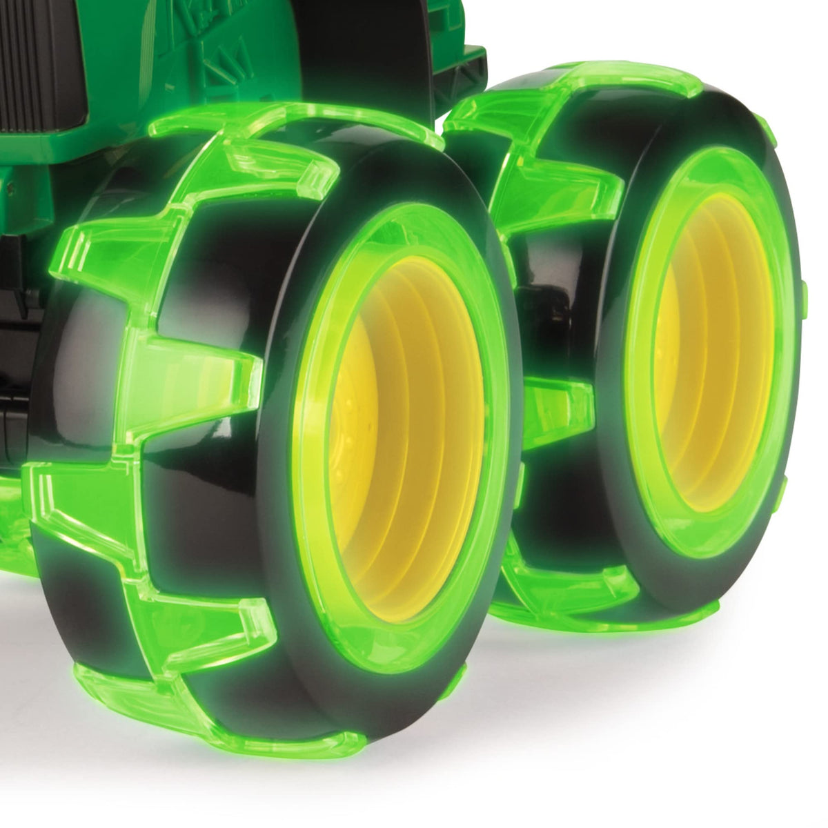 TOMY Monster Treads Lightning Wheels John Deere Tractor side view, motion-activated lights enhance play.