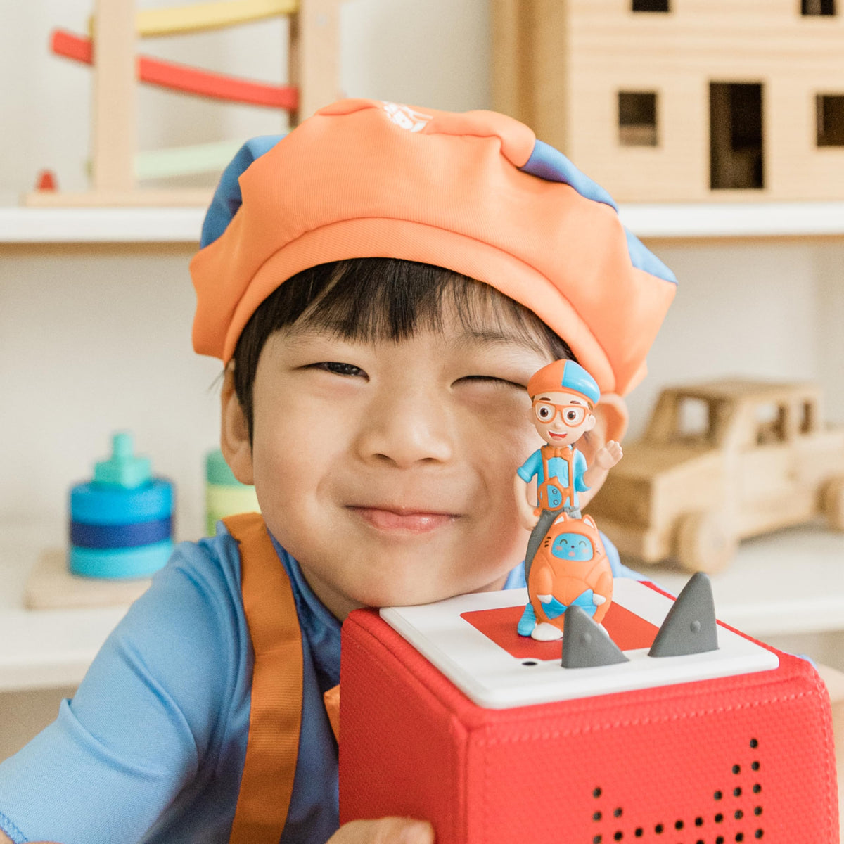 Tonies Blippi mobile beside pirate ship scene invites adventure-themed listening