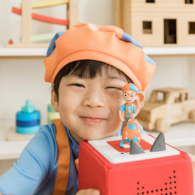 Tonies Blippi mobile beside pirate ship scene invites adventure-themed listening