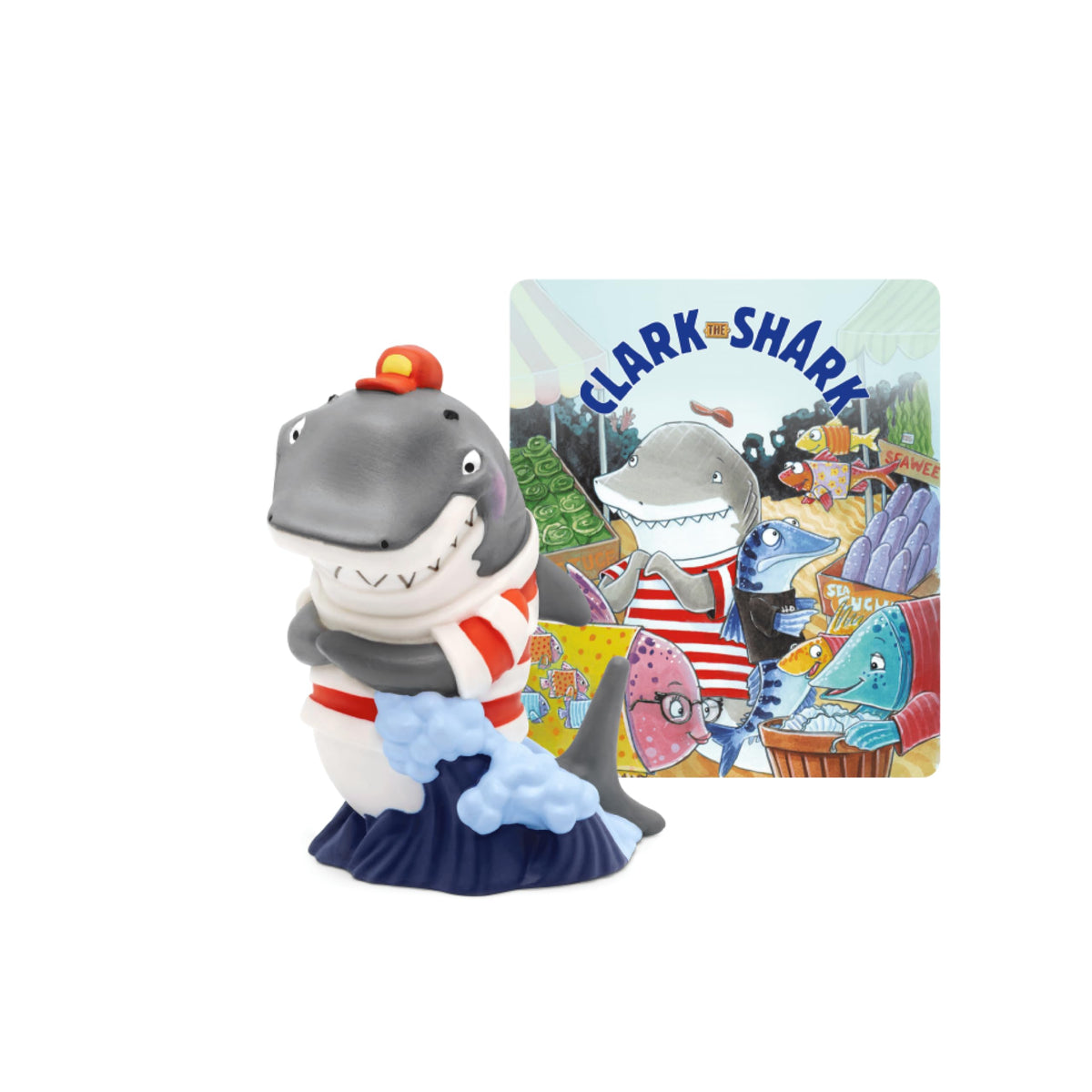 Tonies Clark the Shark audio play character figure beside a Toniebox for imaginative listening sessions.