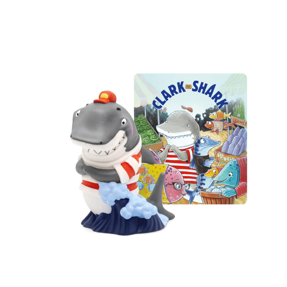 Tonies Clark the Shark audio play character figure beside a Toniebox for imaginative listening sessions.
