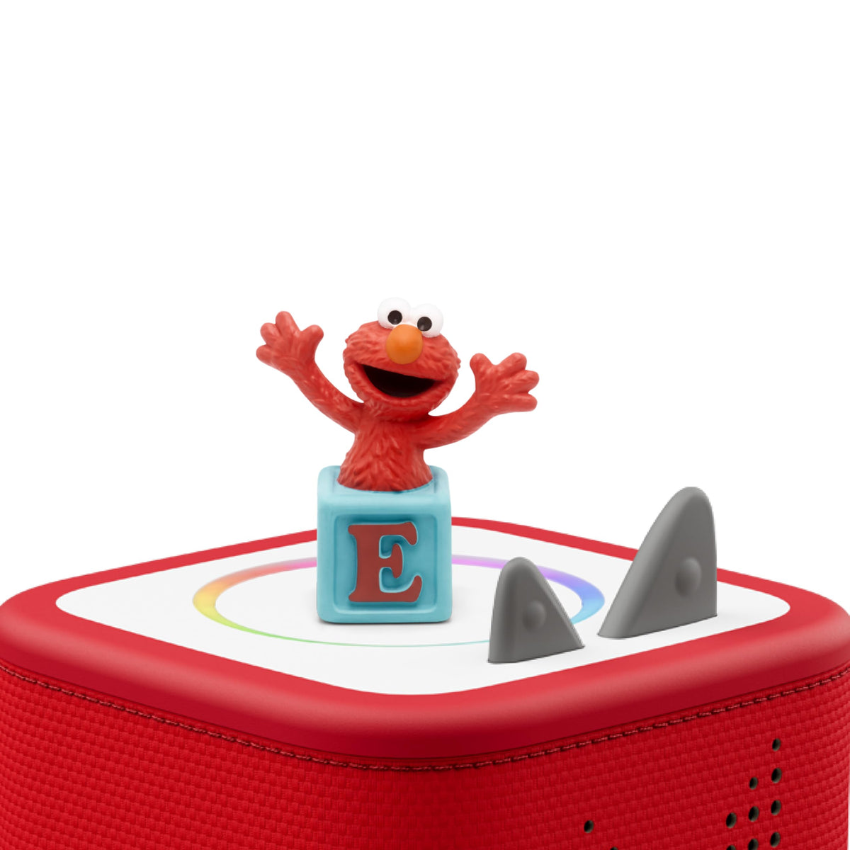 Tonies Elmo figure beside a Toniebox, ideal for screen-free storytelling sessions.