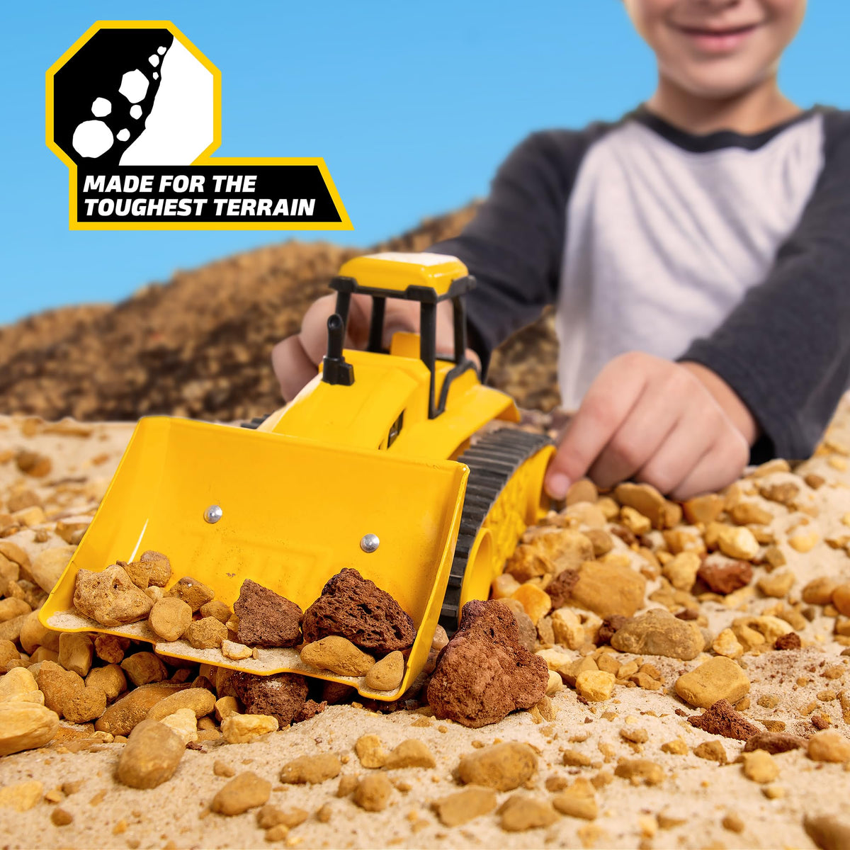 Tonka bulldozer with movable blade for realistic site leveling play.