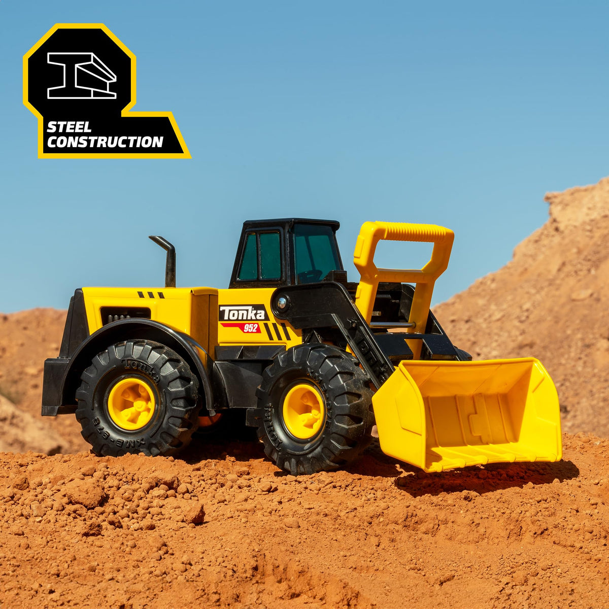 Tonka Front Loader showing scoop action for realistic digging play.