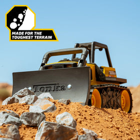 Tonka Bulldozer toy on sandbox-ready surface for hands-on fun.