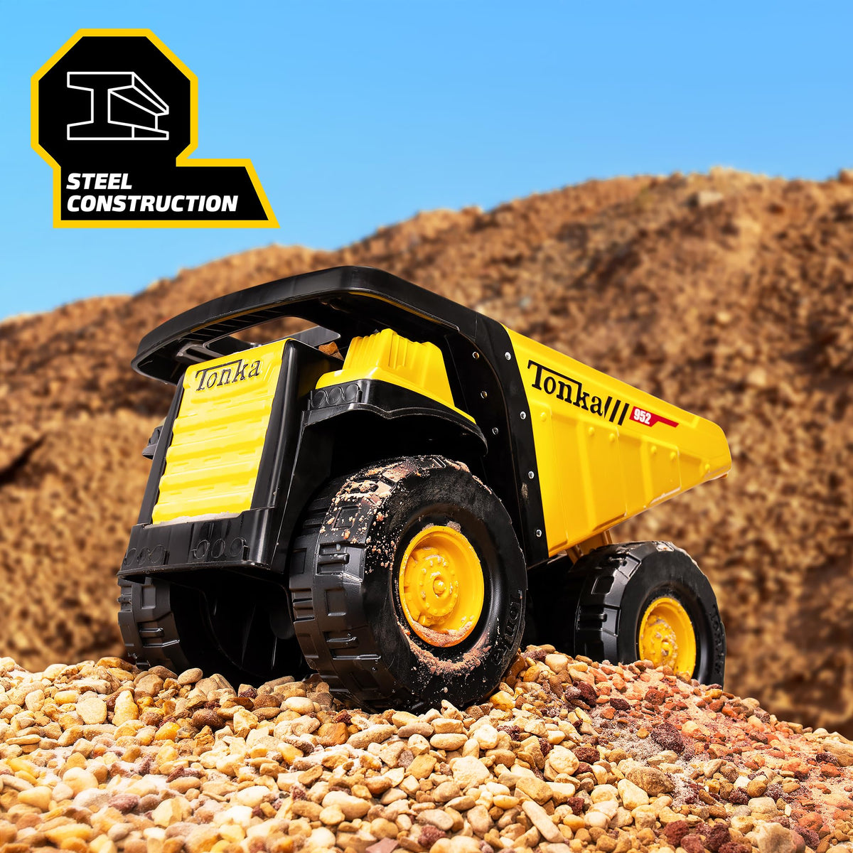 Tonka Steel Classics Mighty Dump Truck side view, big tires roll over varied surfaces