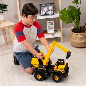 Tonka Mighty Excavator metal bucket highlights tough lifting during pretend construction.