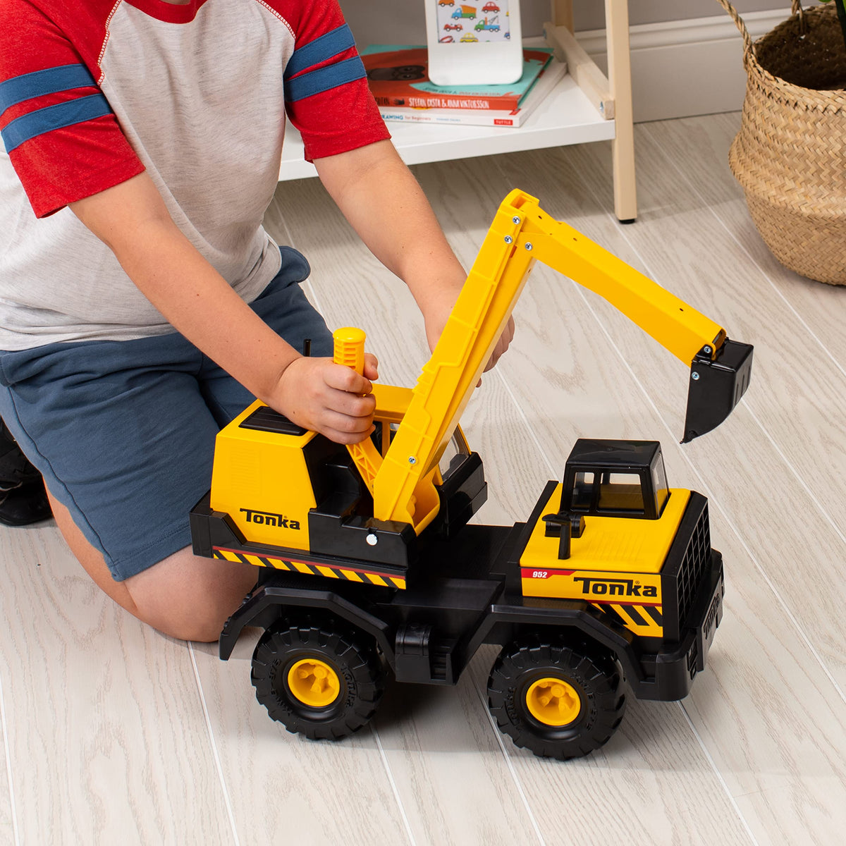 Tonka Mighty Excavator real treads provide stable outdoor mobility on rugged surfaces.