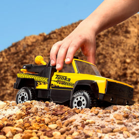 Tonka Tow Truck with kids playing emphasizes imaginative open-ended play.