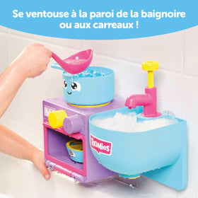 Toomies Bubble & Bake ladle pourer invites scooping and stirring during bath