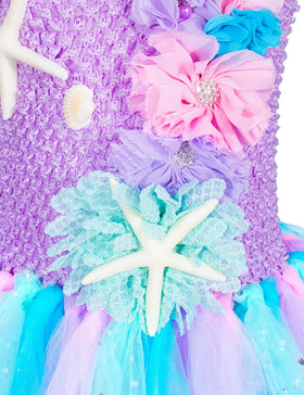 Topney Hairband detail showcasing playful seashell elements and elastic fit.