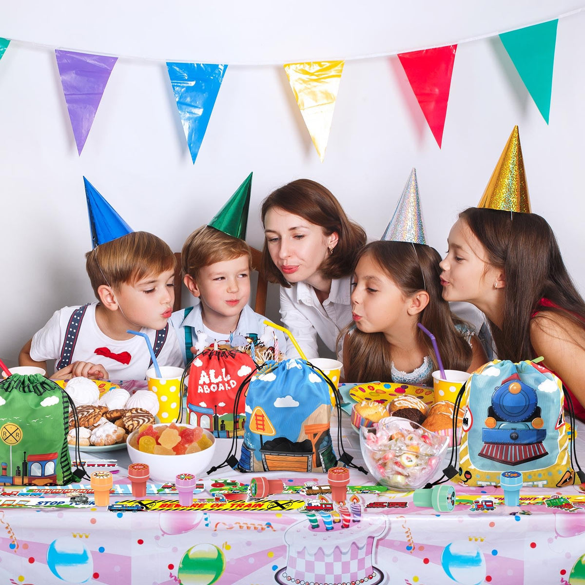 TOQI Train Favors party decorations unify colors across tables and rooms