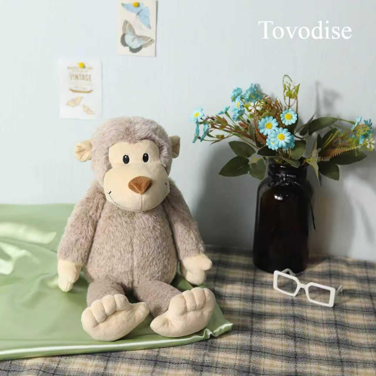 Tovodise plush monkey toy, bedtime friend ready for cozy nights.