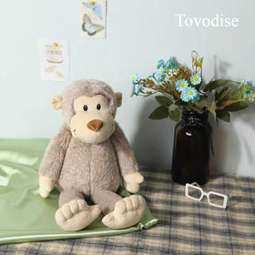 Tovodise plush monkey toy, bedtime friend ready for cozy nights.