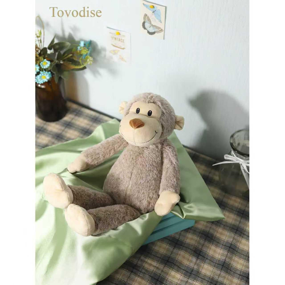 Tovodise plush monkey toy, nursery decor accent staying soft after hugs.