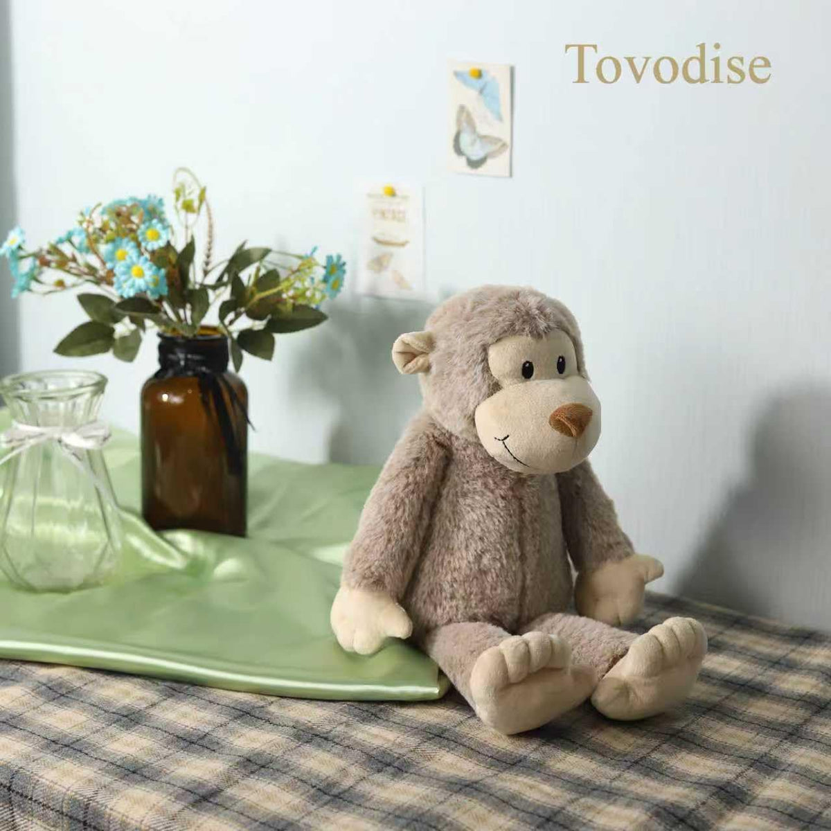 Tovodise plush monkey toy, cuddly companion for bedtime routines and imaginative play.