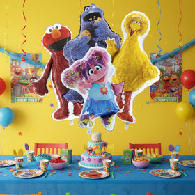 Toyland Sesame Street foil balloons gleaming under lights for festive mood.