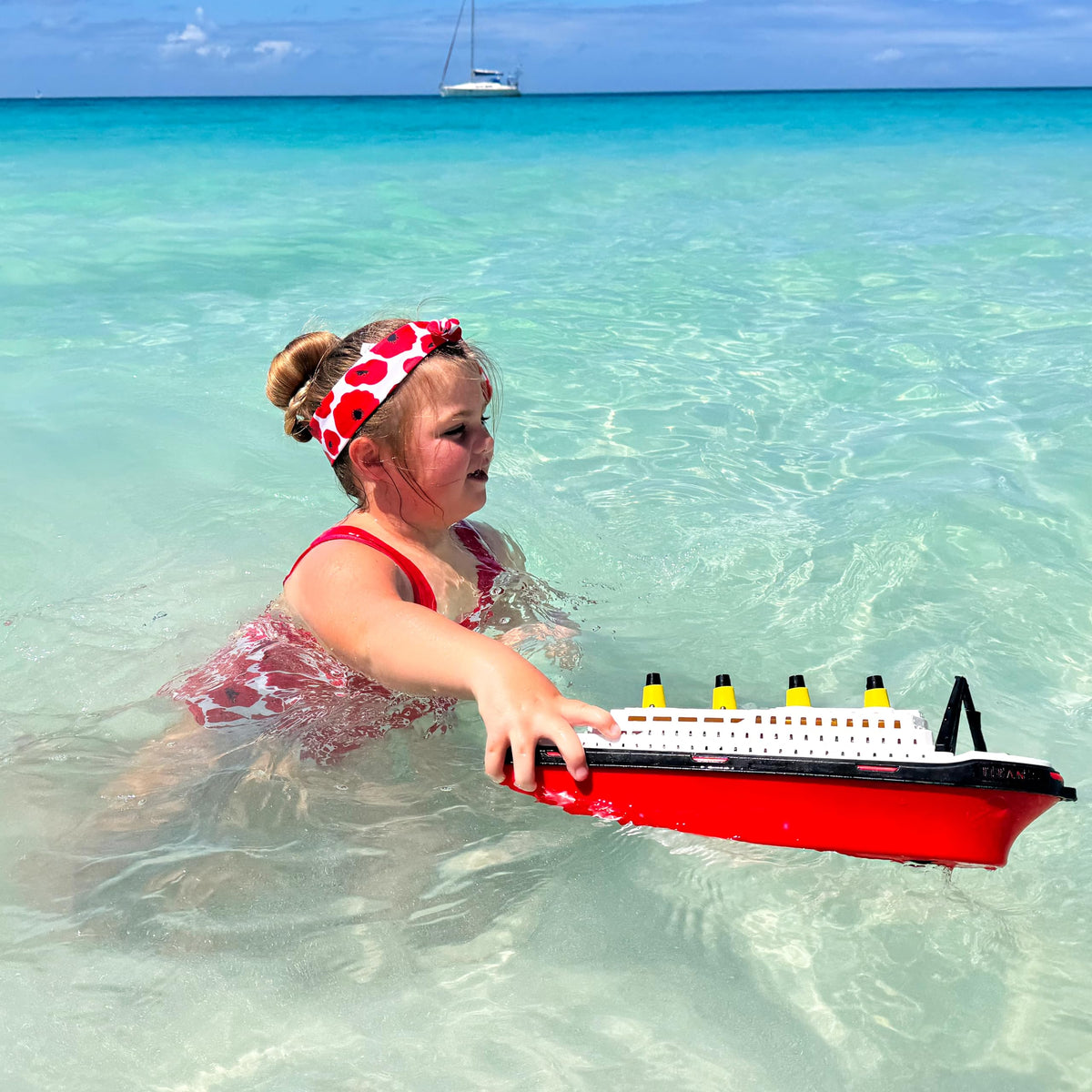 Toyland Titanic boat shows its two-wheel base for easy push play.