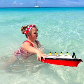 Toyland Titanic boat shows its two-wheel base for easy push play.