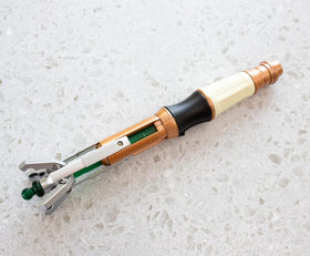 Toynk Doctor Who 11th Doctor sonic screwdriver prop official licensed badge visible.