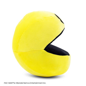 Toynk Pac-Man 7-Inch Plush lounging on a bed adds a cute gaming room accent.