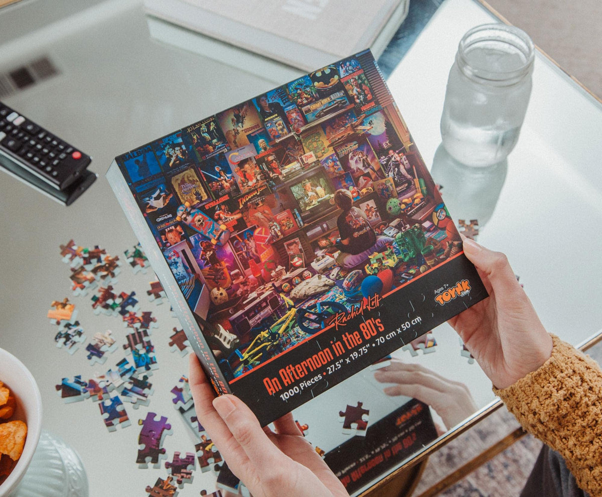Retro movie icons like Indiana Jones and He-Man on neon-inspired puzzle art