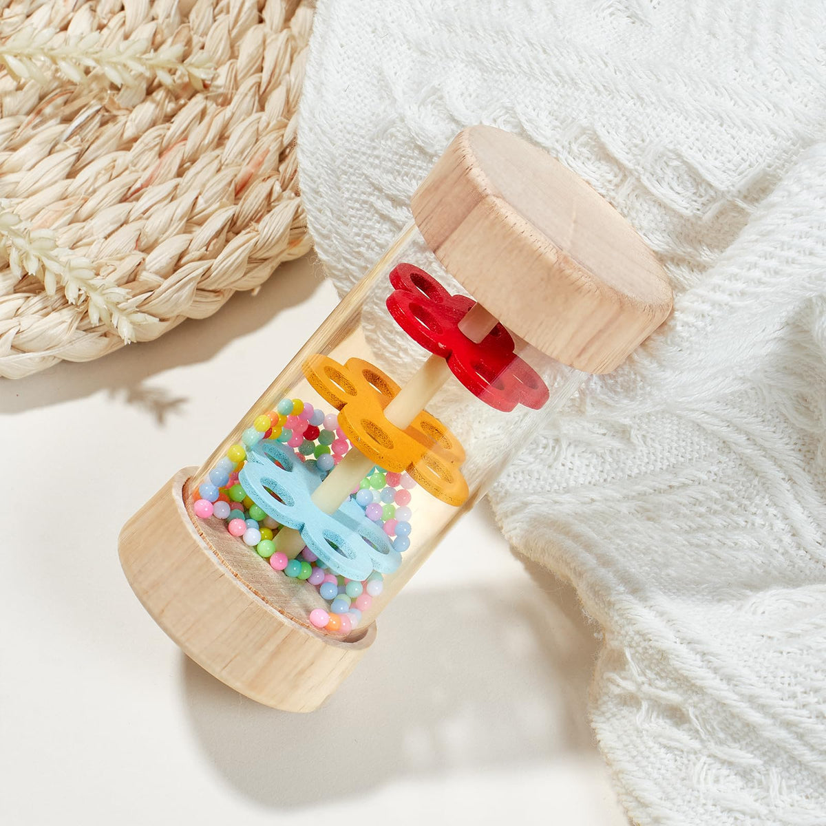 Toyssa rain-sound hourglass adds soft, soothing percussion during playtime.