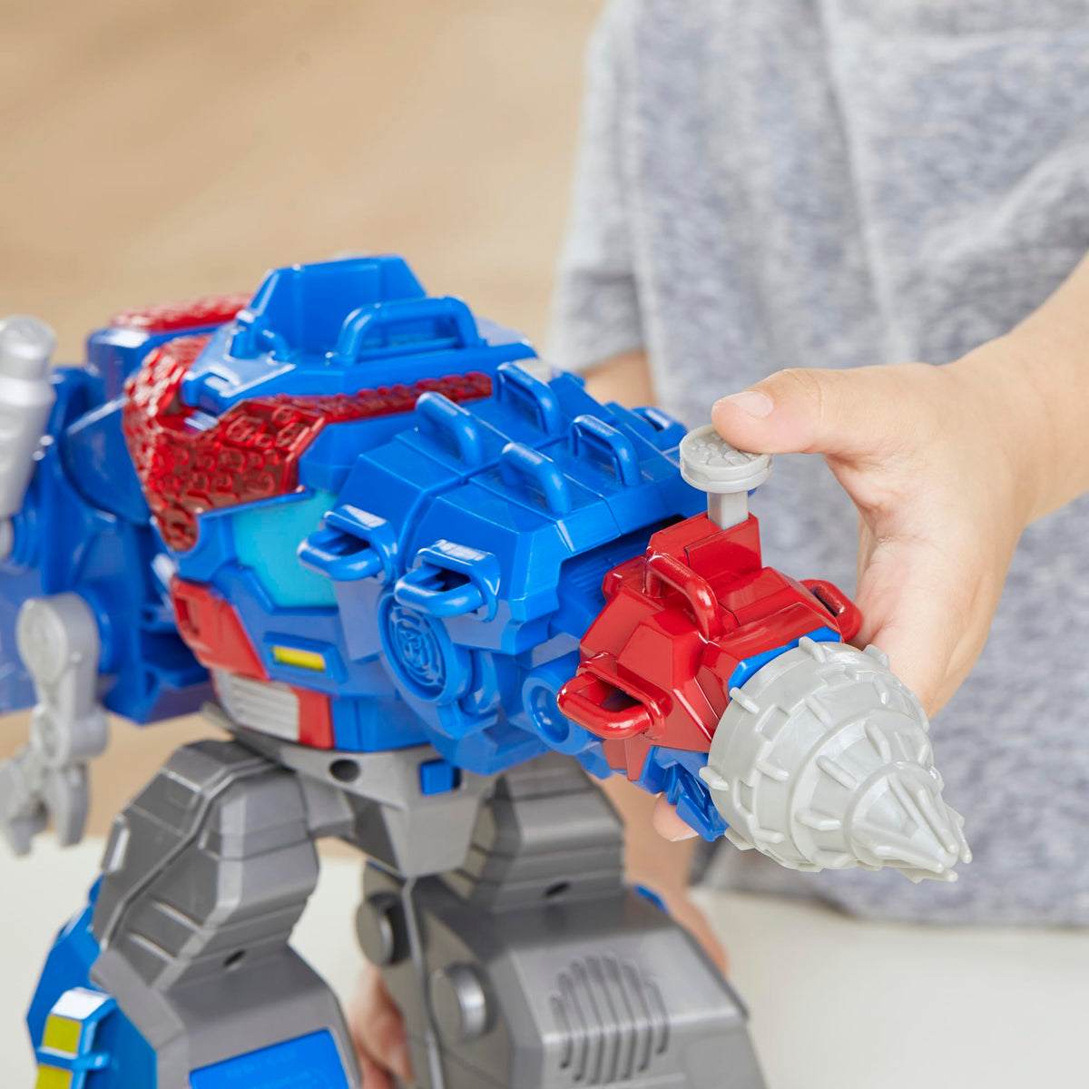 Rescue drill spins in both modes for interactive play on Optimus Prime T Rex toy