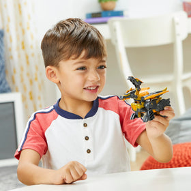 Snarl toy in pack showing quick 2-do conversion to Stegosaurus form.