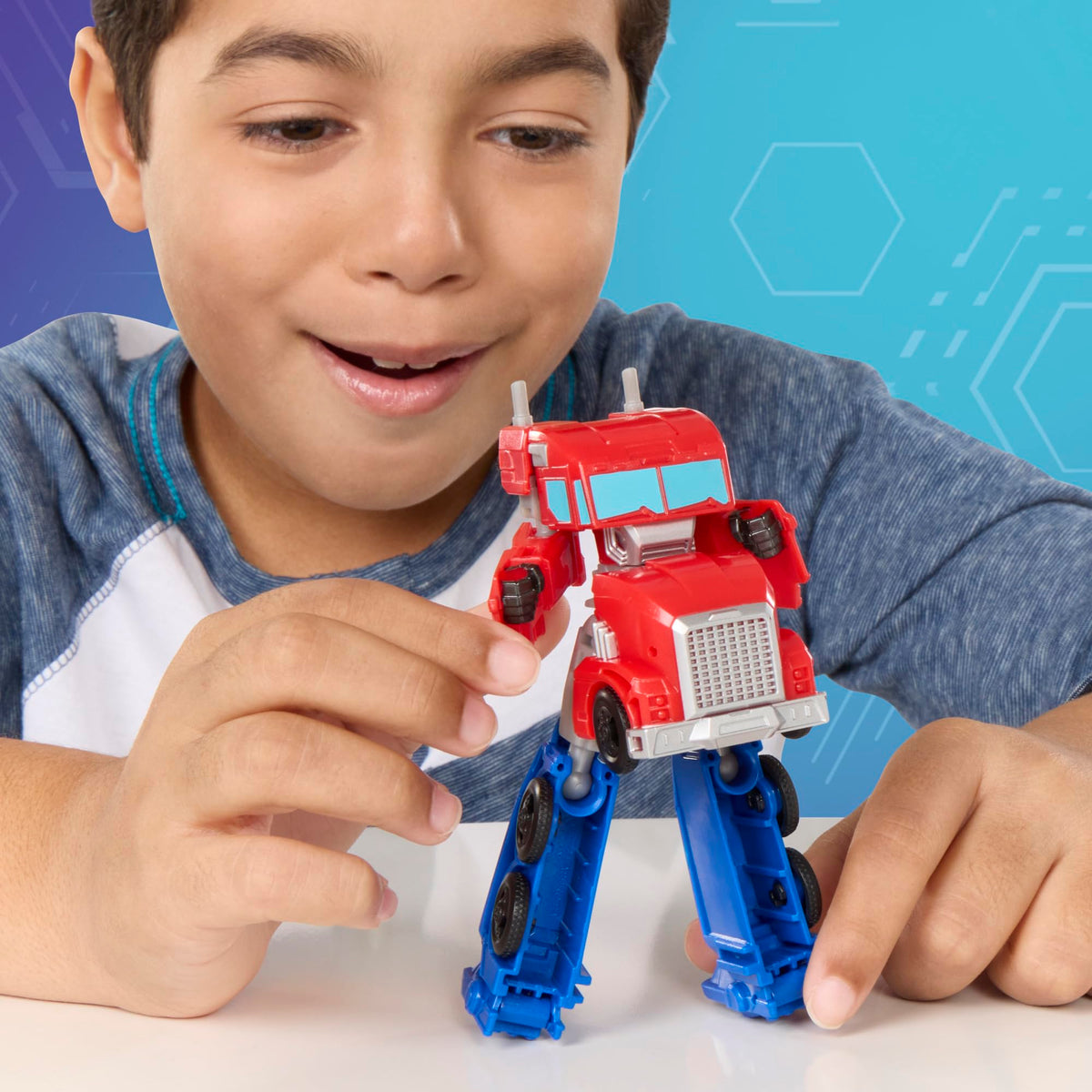 Transformers EarthSpark Optimus Prime 5-inch action figure in dynamic pose for playsets.