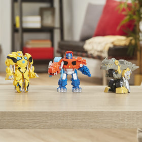 Transformers Primal Team-Up kids holding figures for hands-on learning and pretend adventures