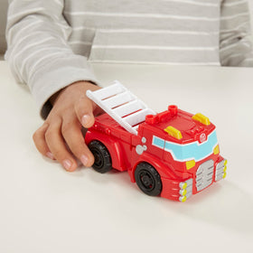 Transformers Rescue Bots Griffin Rock Chase police car in dynamic pose