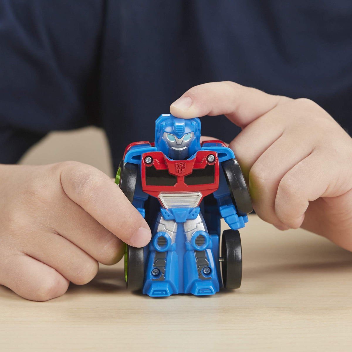 Transformers Rescue Bots Hoist mini bot racer demonstrates easy mode conversion for kids.