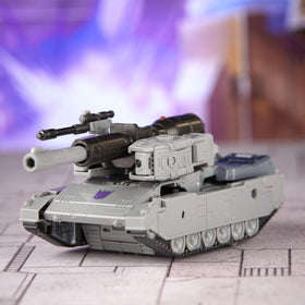 Megatron saber accessory shown with action figure in dynamic stance.