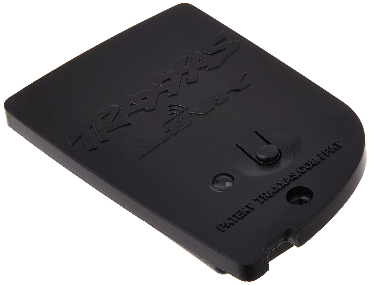 Traxxas 6511 TQi Link Wireless Module connects to a smartphone for real-time tuning data