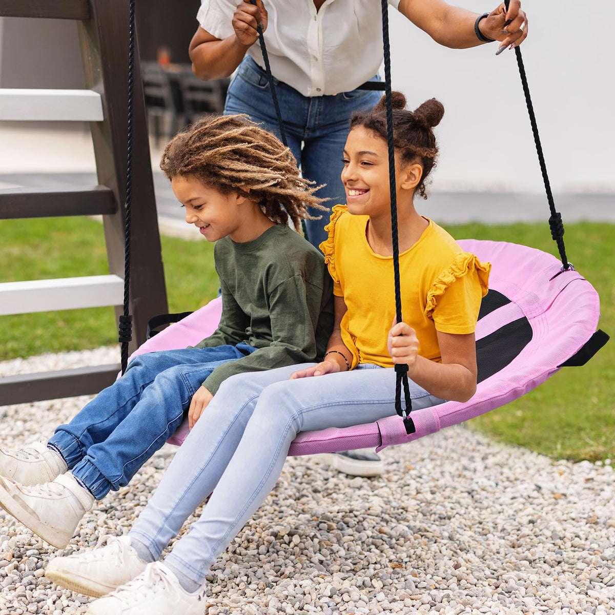 Trekassy pink saucer swing promotes safe shared play for kids and adults alike.